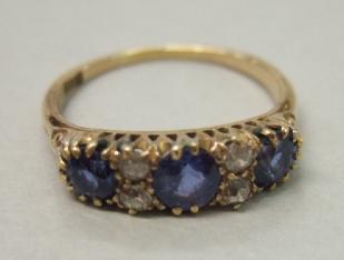 Appraisal: A gold sapphire and diamond set ring mounted with three