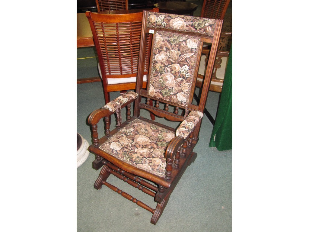 Appraisal: American mahogany spring rocker armchair