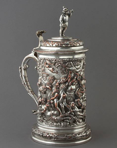 Appraisal: A Victorian silver plated lidded tankard with repousse decoration height