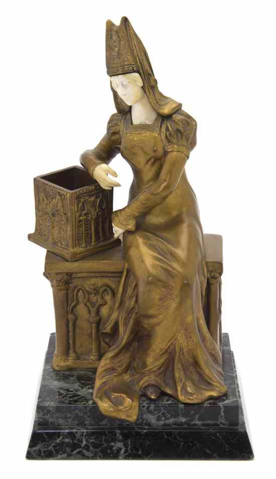 Appraisal: A French Gilt Bronze and Ivory Figure Raphanel depicting a