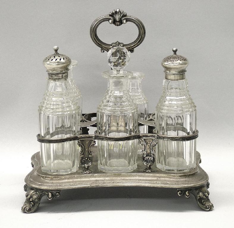 Appraisal: William IV seven bottle rectangular cruet upon a stepped rectangular