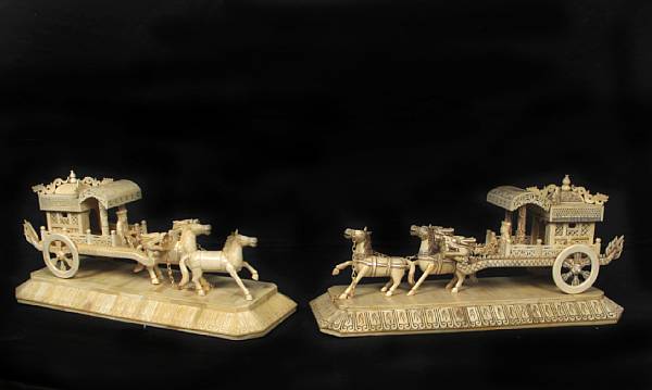 Appraisal: A pair of Chinese carved chariots height in width in