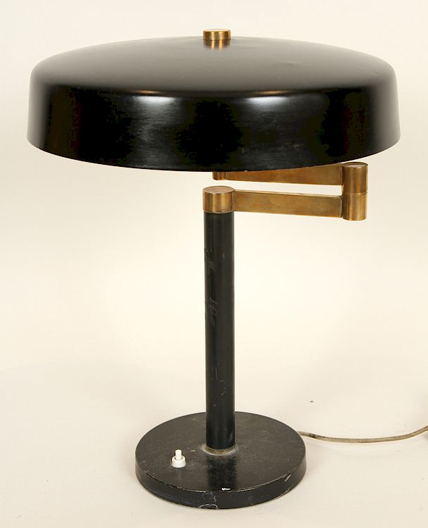 Appraisal: ADJUSTABLE BRASS IRON DESK LAMP CIRCA An adjustable brass and