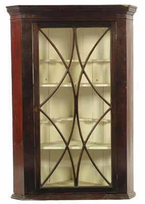 Appraisal: A late George III mahogany hanging corner cupboard the astragal