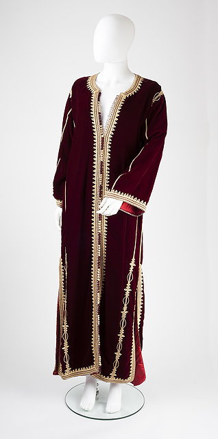 Appraisal: A full length maroon velvet kaftan with long sleeves round