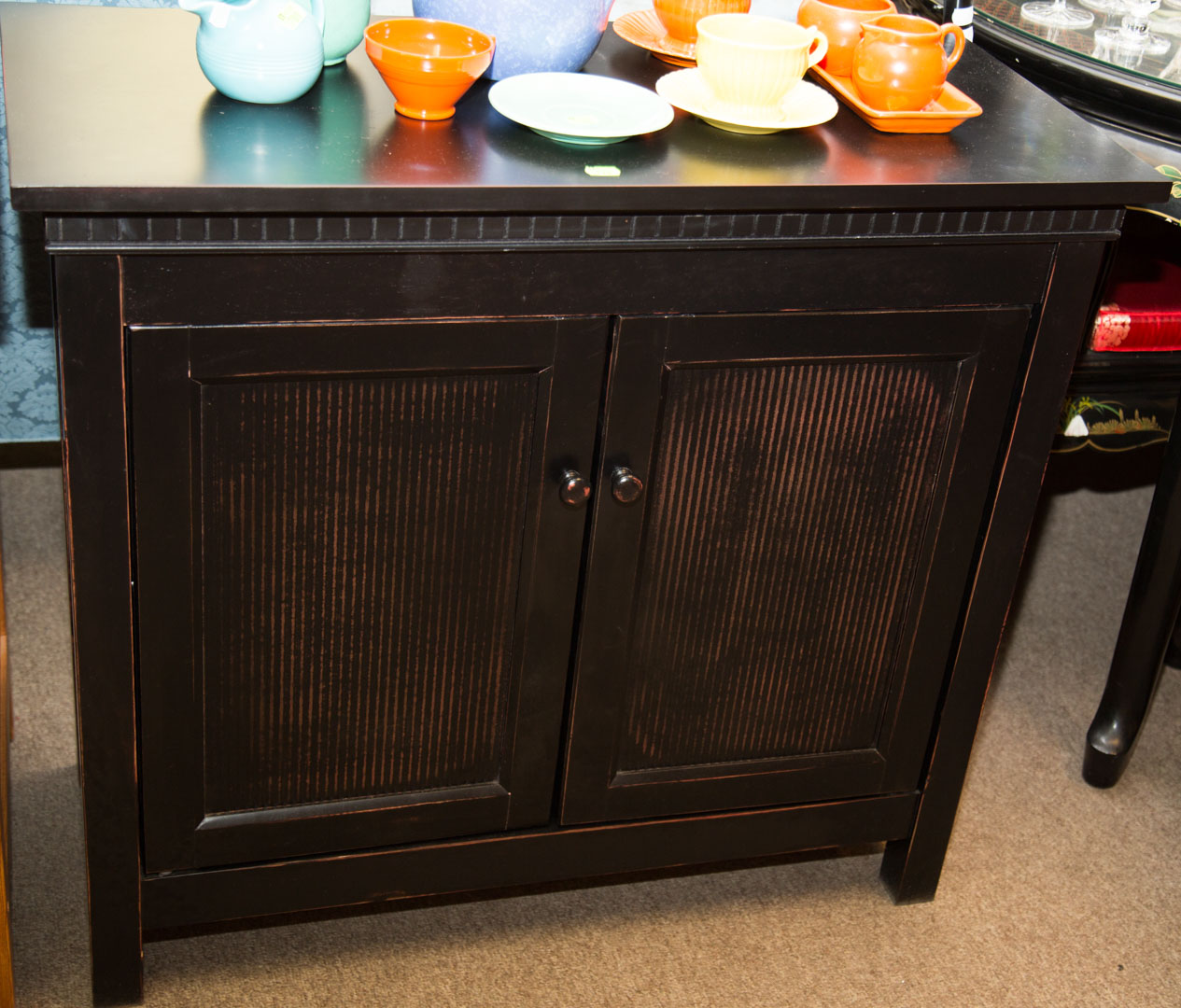 Appraisal: Black wood two-door cabinet