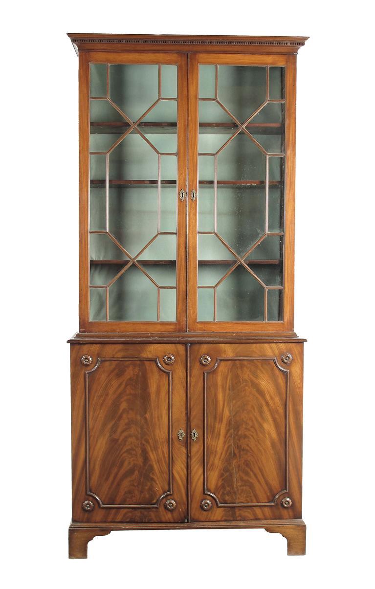 Appraisal: An early th century mahogany bookcase cabinet