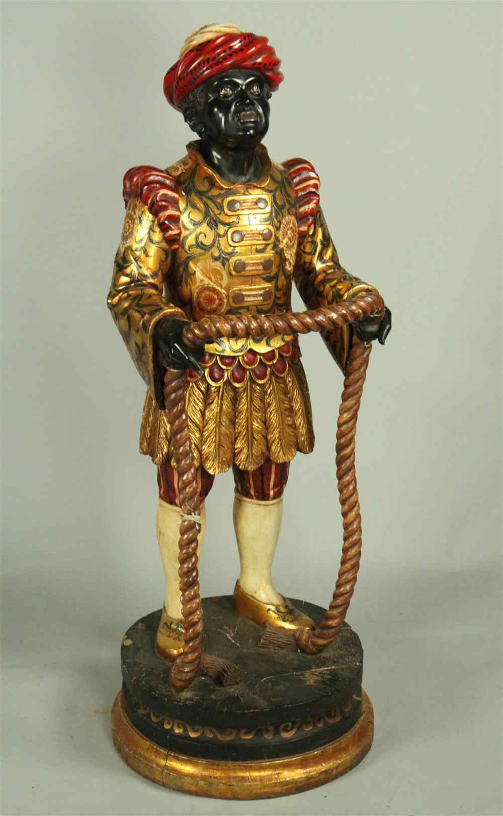 Appraisal: CONTINENTAL POLYCHROME AND GILTWOOD FIGURE OF A BLACKAMOOR probably th