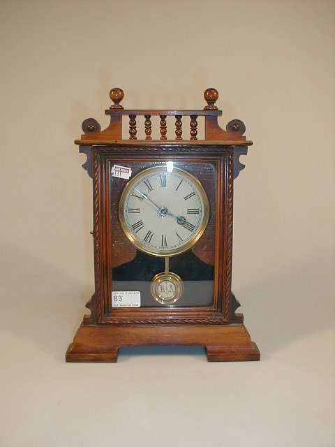 Appraisal: A Victorian walnut mantel clock