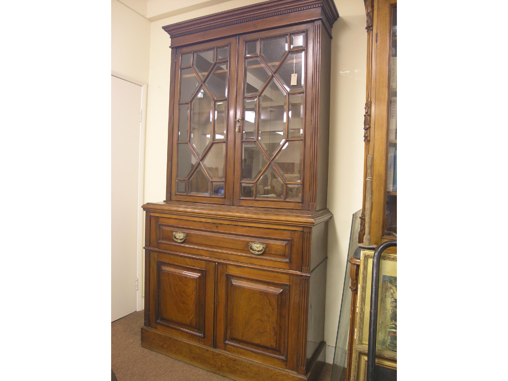 Appraisal: A Victorian walnut secretaire bookcase pair of astragal bevelled glass