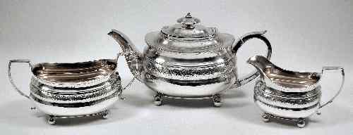 Appraisal: A George III silver three piece tea service the squat