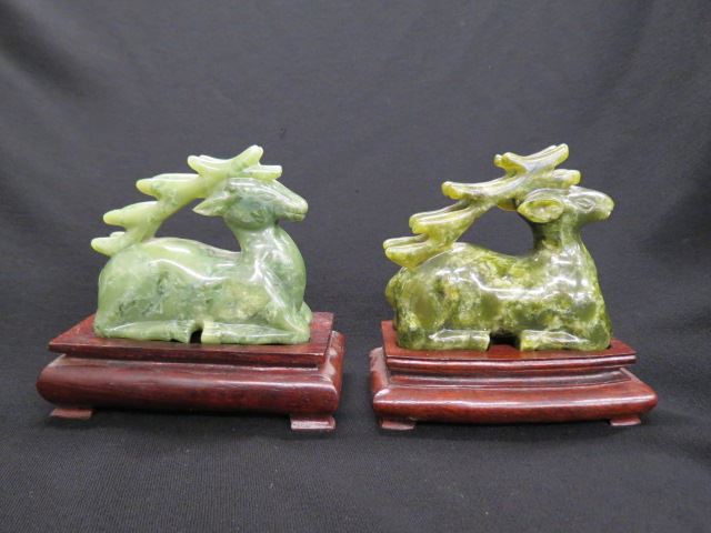 Appraisal: Pair of Chinese Figurines of Deer spinach green plus wooden