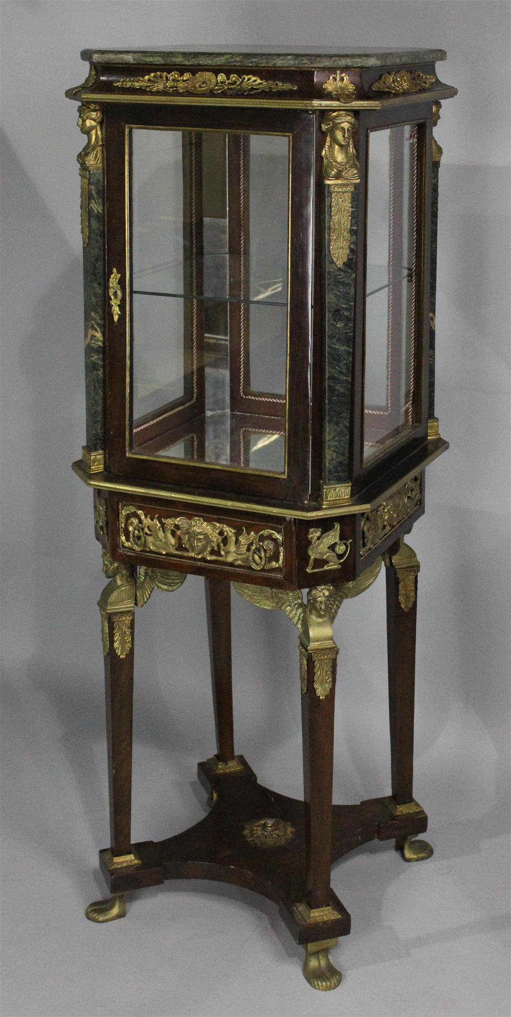 Appraisal: EMPIRE STYLE MARBLE AND GILT METAL MOUNTED MAHOGANY DISPLAY green