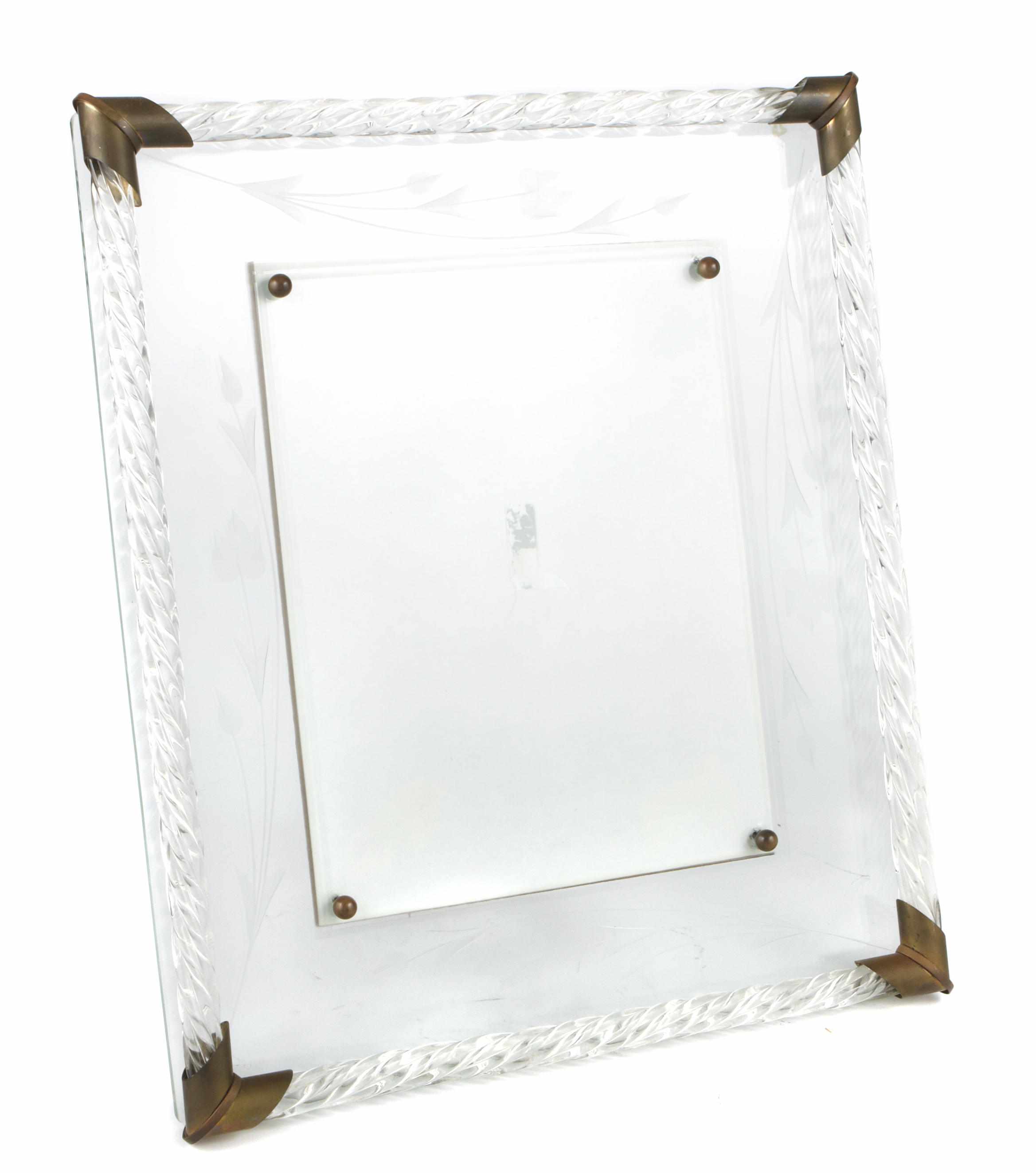 Appraisal: An Italian brass and glass picture frame height in width