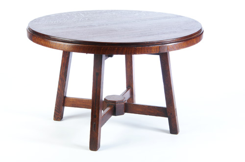 Appraisal: LIMBERT Ebon-oak round table with a circular top canted legs