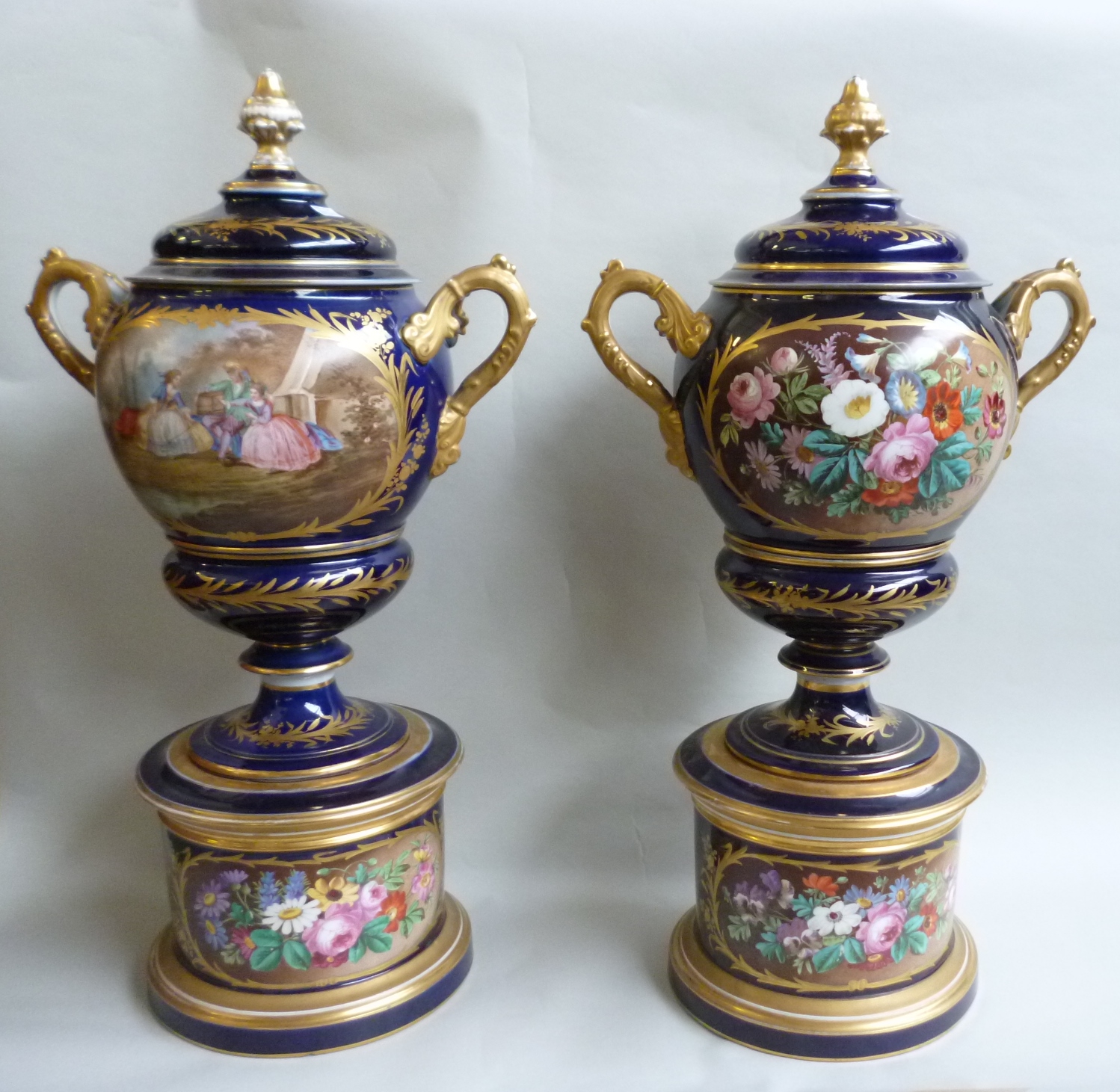 Appraisal: A pair of Sevres style two handled dark blue ground