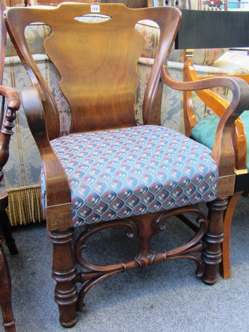 Appraisal: A th century walnut framed open armchair with wide vase