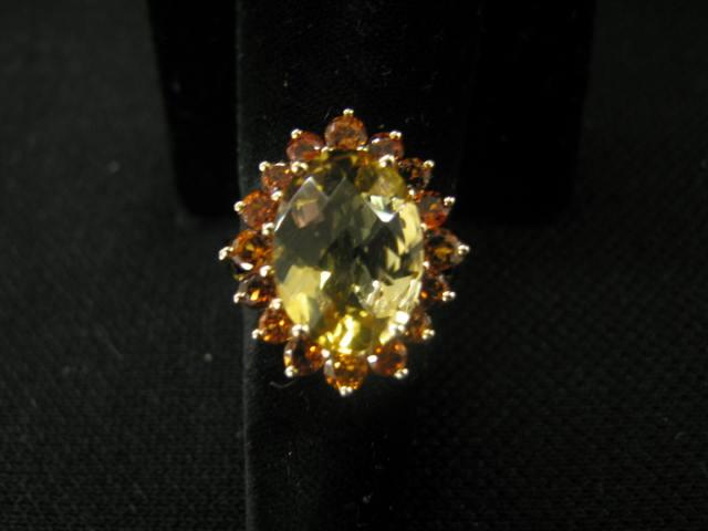 Appraisal: Citrine and Orange Garnet Ring one oval gem of carats