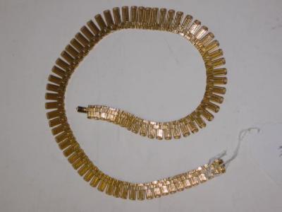 Appraisal: AN CT GOLD NECKLACE comprising graduated engine turned cylindrical links