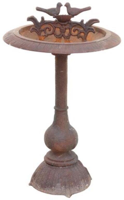 Appraisal: Cast iron bird bath late th c with pair of