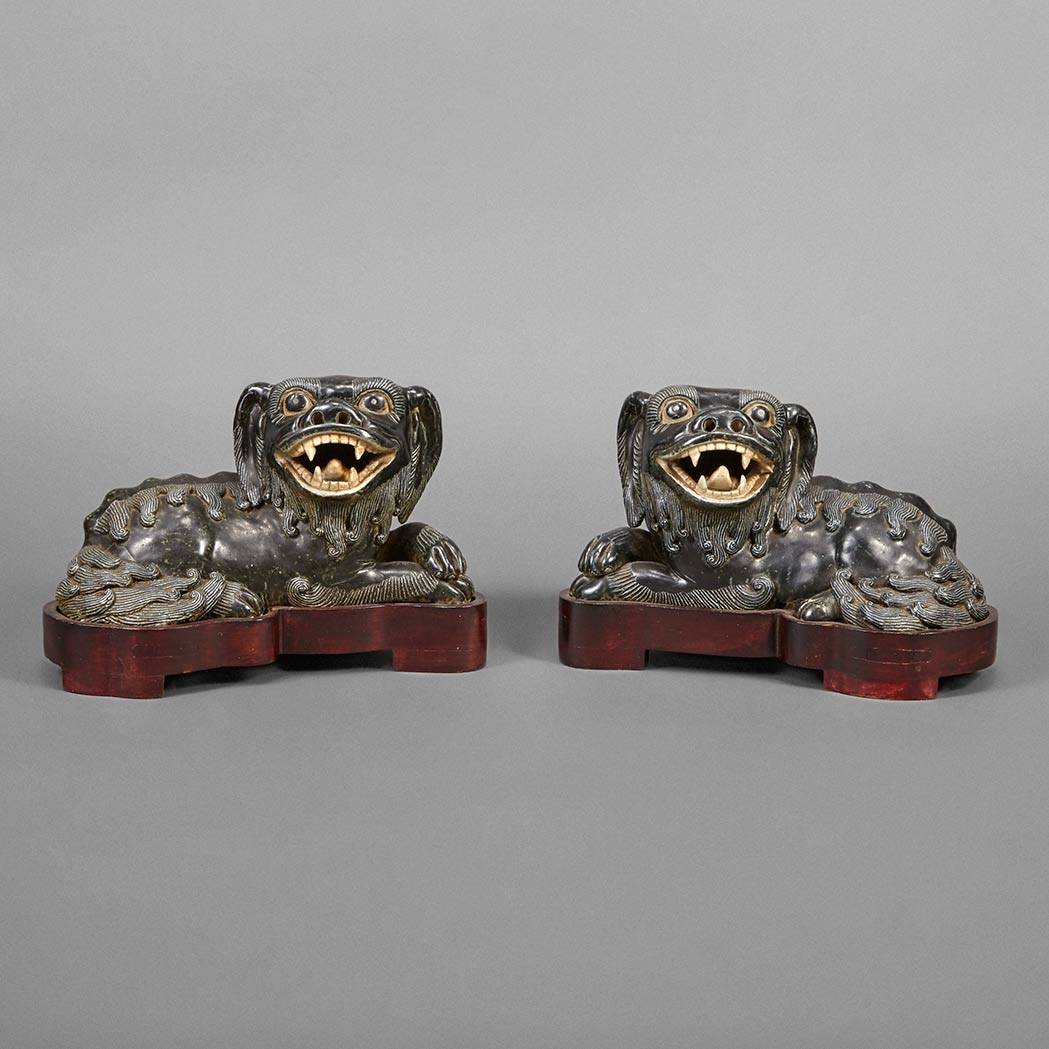 Appraisal: Pair of Chinese Black Glazed Porcelain Figures of Fu Dogs