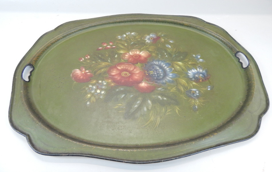 Appraisal: A Toleware tray with a shaped border the centre painted