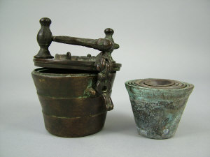 Appraisal: An Asian bronze nest of seven weights the hinged lid