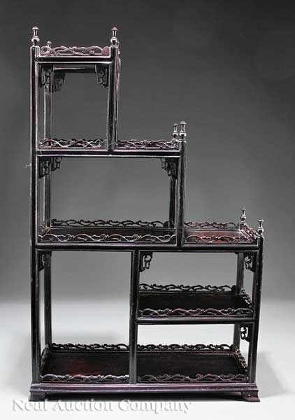 Appraisal: A Chinese Rosewood Display Stand tiered stepped shelves with reticulated