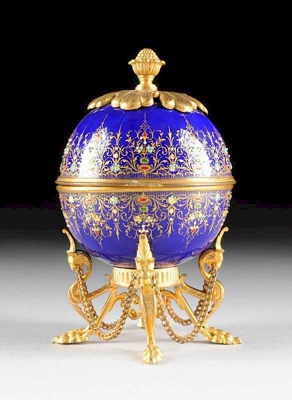 Appraisal: A FRENCH ENAMEL ON COPPER EGG SHAPE FITTED SCENT CASKET