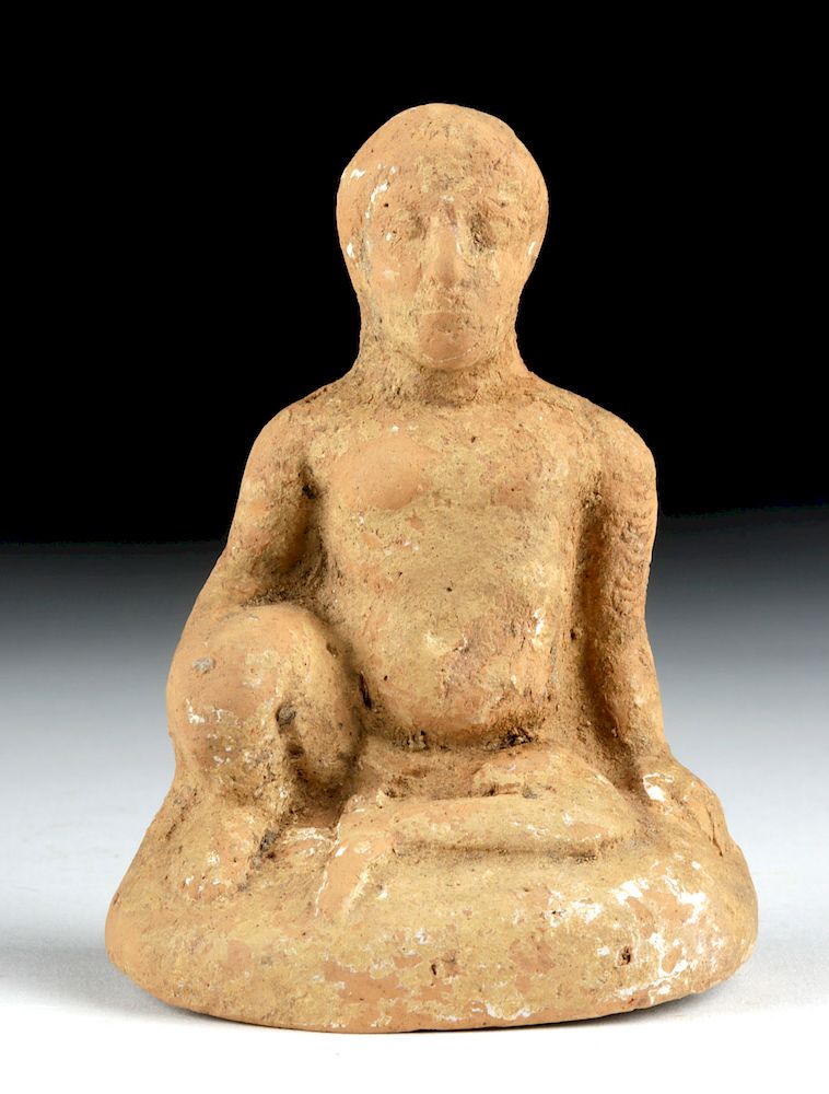 Appraisal: Greek Archaic Terracotta - Seated Nude Boy Originally Listed At