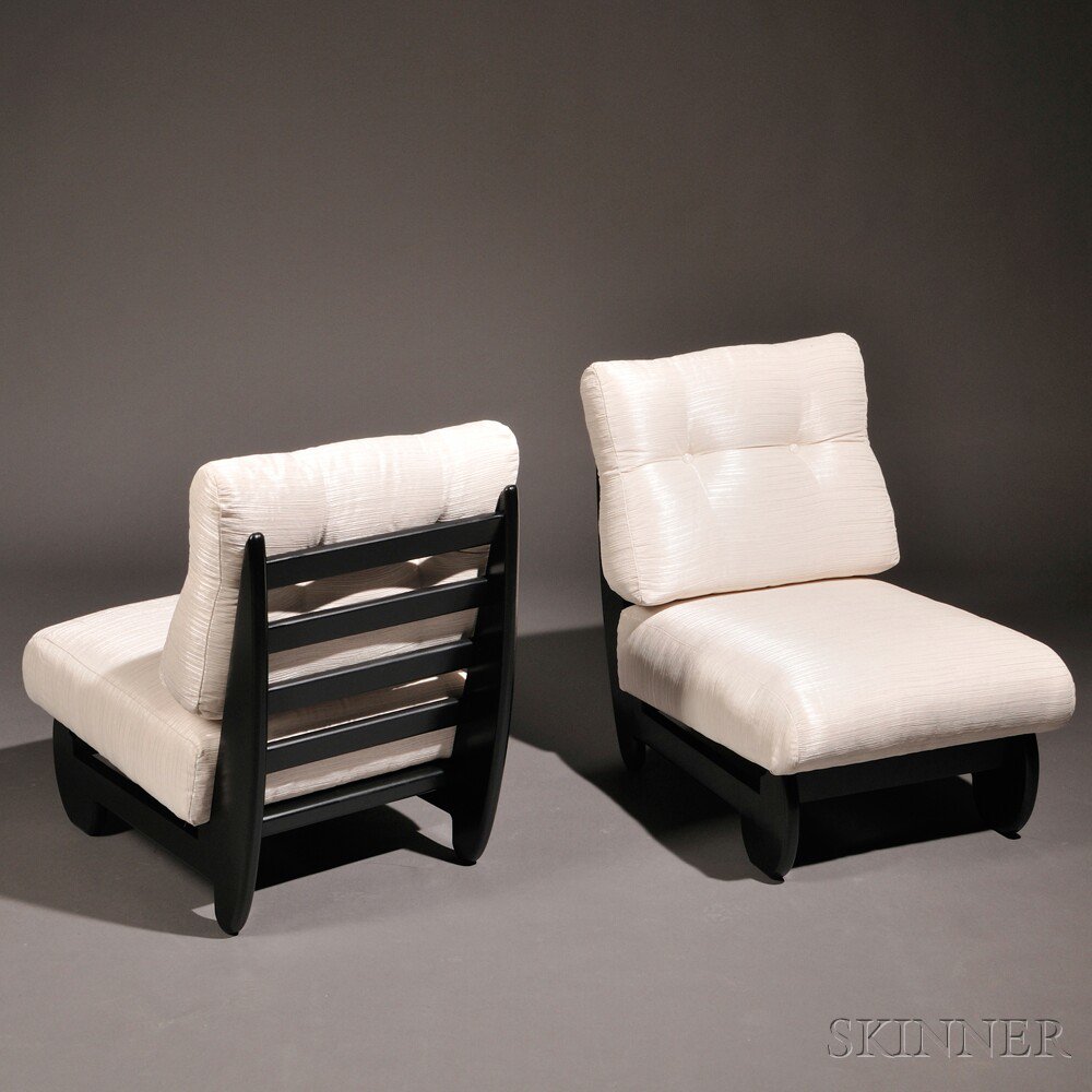 Appraisal: Two Paul Lazlo Lounge Chairs Ebonized wood and upholstery United