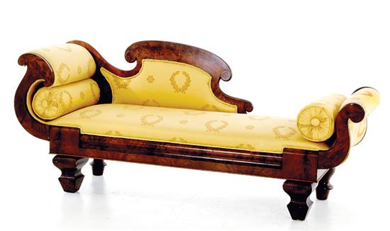 Appraisal: American Empire carved mahogany chaise lounge circa cornucopia headrest extending