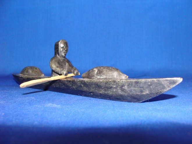 Appraisal: ist th century MAN IN KAYAK WITH SEAL CARCASES L