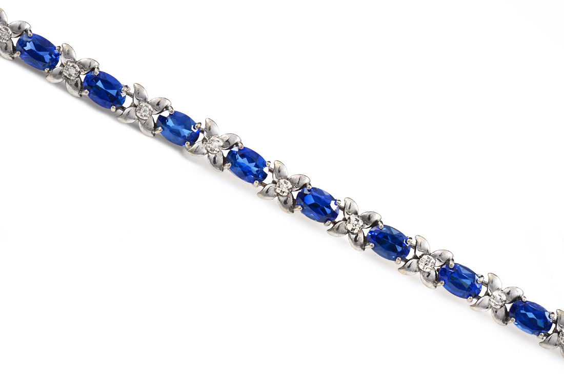 Appraisal: SAPPHIRE DIAMOND LINE BRACELET K white gold bracelet contains oval