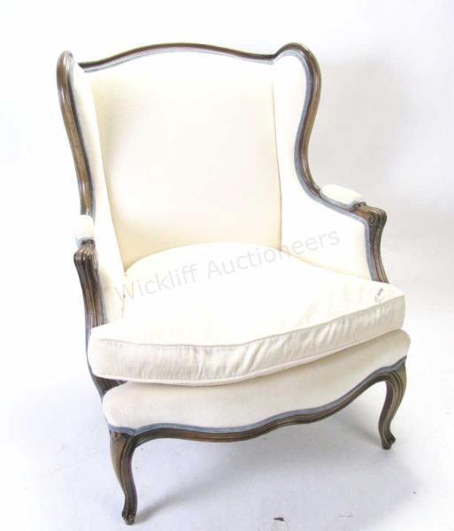 Appraisal: A vintage French style bergere cream color upholstery with carved