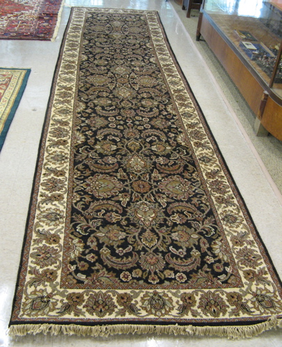 Appraisal: HAND KNOTTED ORIENTAL CORRIDOR CARPET Indo-Persian overall scrolling floral arabesque