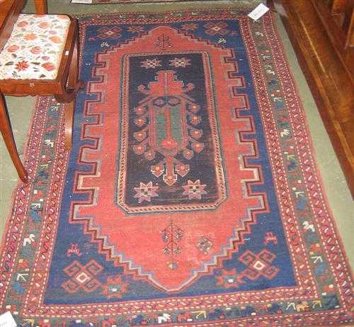 Appraisal: KAZAK antique Blue ground with black and red central medallion