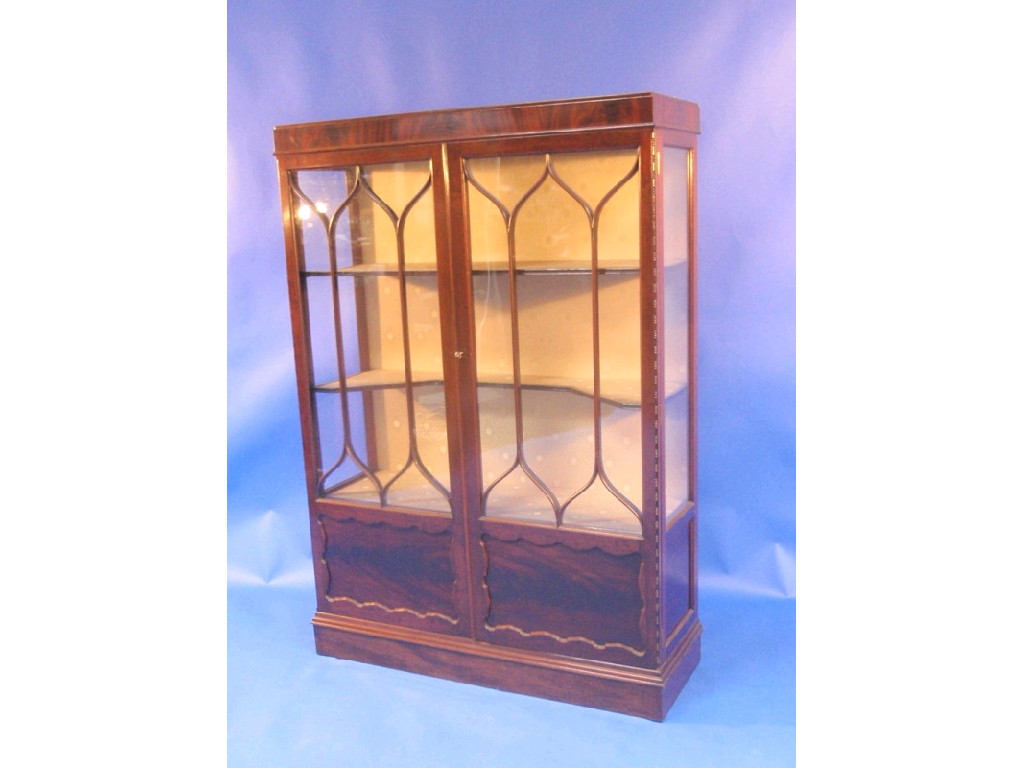 Appraisal: An Edwardian flamed mahogany two door display cabinet with astragal