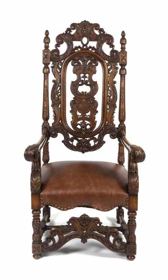 Appraisal: A Jacobean Style Walnut Hall Chair having an elaborately carved