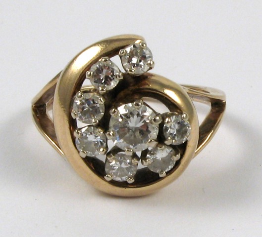 Appraisal: DIAMOND AND FOURTEEN KARAT GOLD RING set with eight round