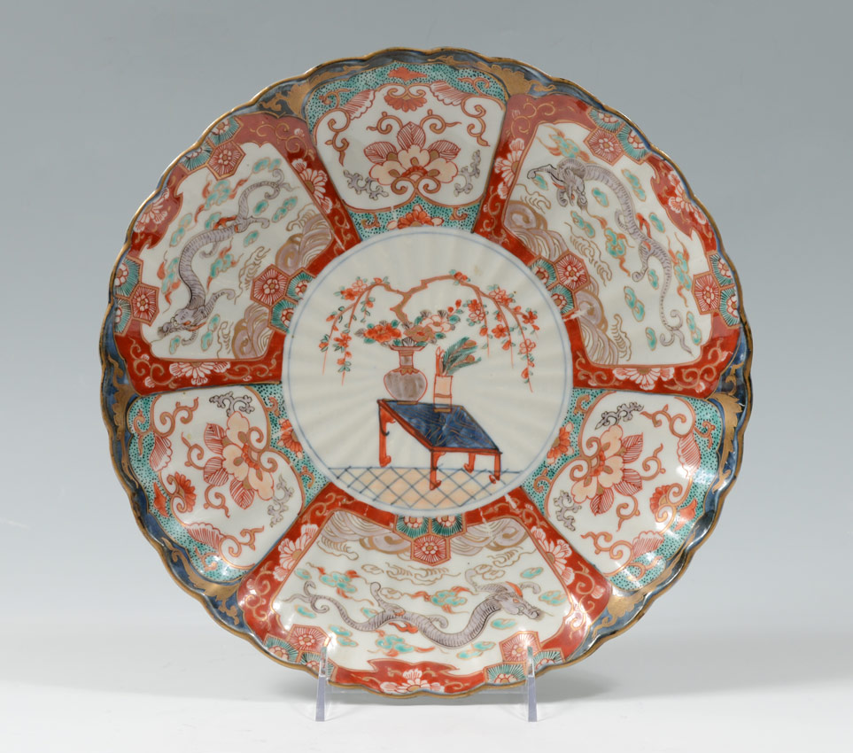 Appraisal: JAPANESE IMARI CHARGER Center with indoor genre scene dragon motifs