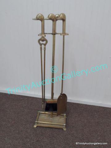 Appraisal: Brass Duck Head Fireplace Set Brass constructed fireplace set with