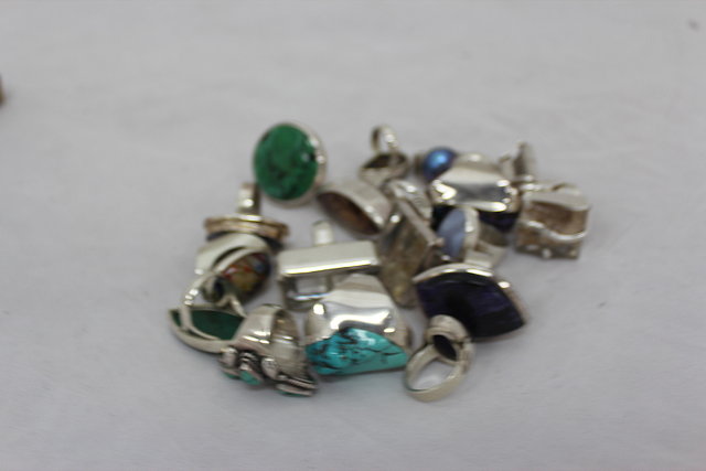 Appraisal: EIGHTEEN CONTEMPORARY SILVER RINGS set with semi precious stones and