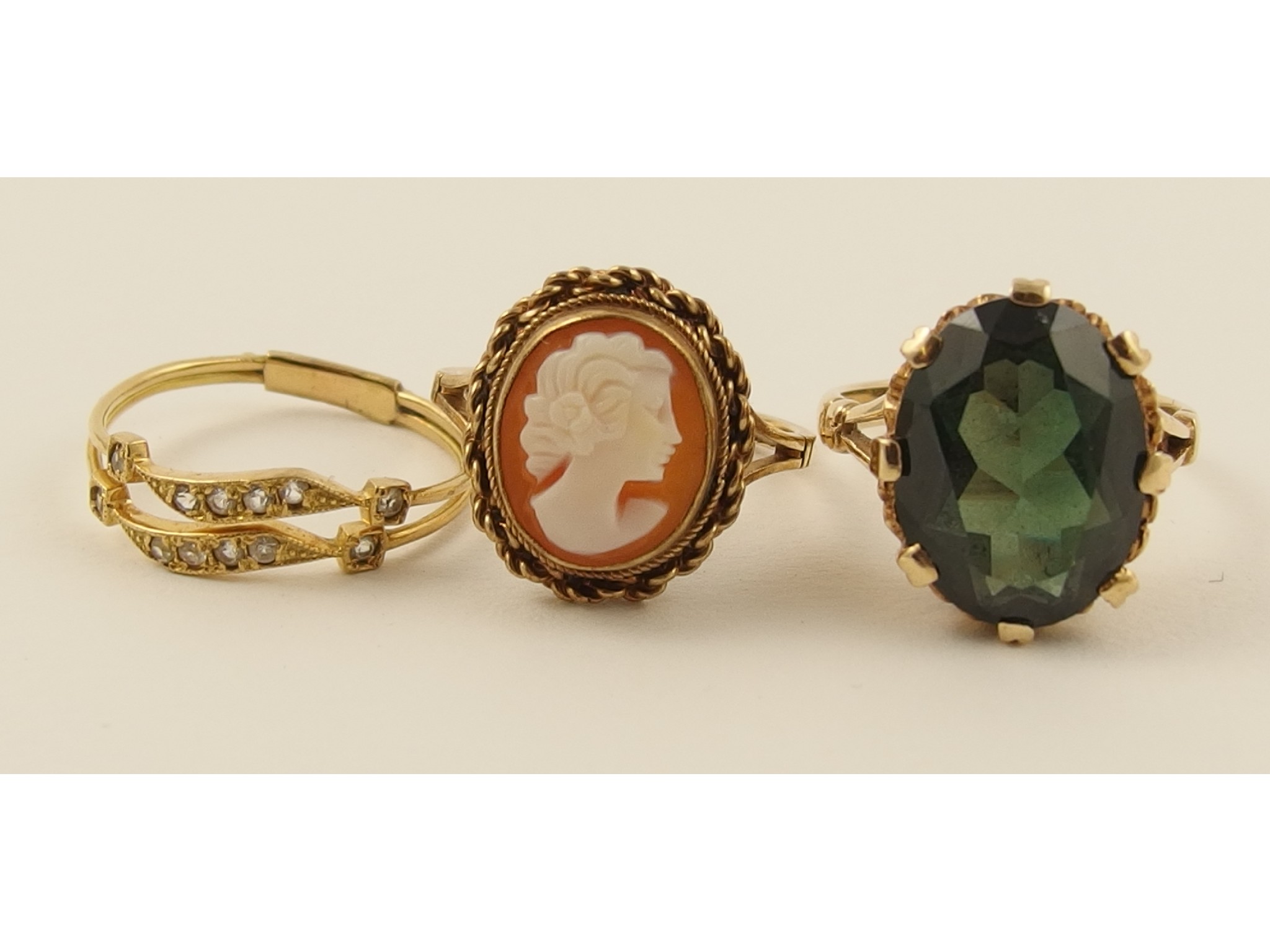 Appraisal: A gem set ct ring together with two other rings