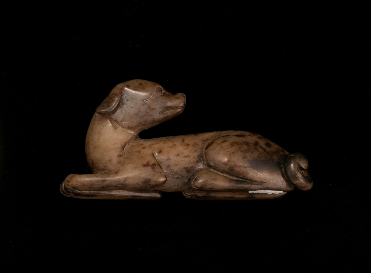 Appraisal: BROWN JADE CARVING Circa In the form of a reclining