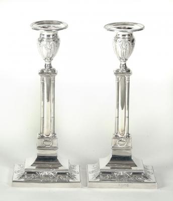 Appraisal: A MATCHED PAIR OF EDWARDIAN CANDLESTICKS maker Thomas Bradbury Sons