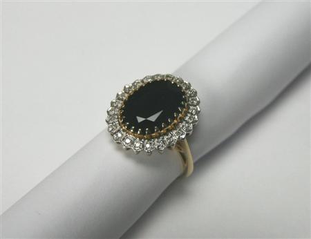 Appraisal: A modern ct gold mounted sapphire and diamond cluster ring