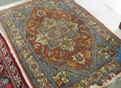 Appraisal: HAND KNOTTED ORIENTAL AREA RUG Indo-Heriz central geometric medallion and