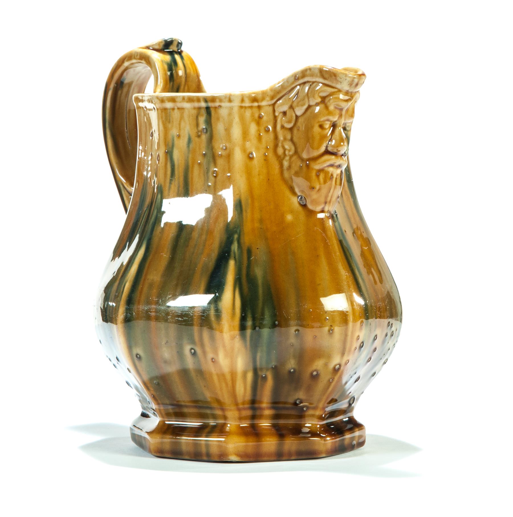 Appraisal: OHIO OCTAGONAL PITCHER WITH HONEY GLAZE AND STREAKED BLUE AND