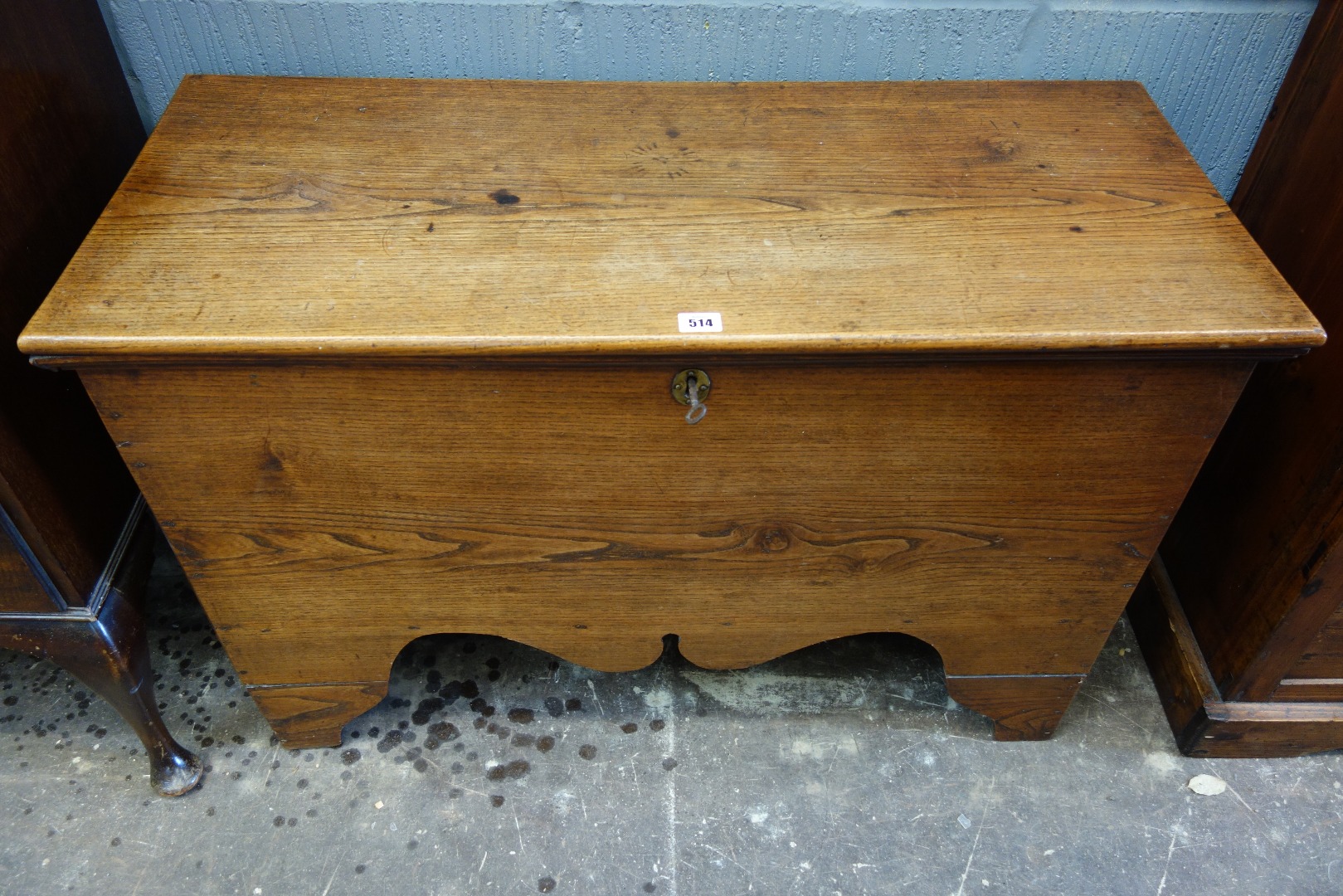 Appraisal: An th century elm coffer with moulded hinged top shaped